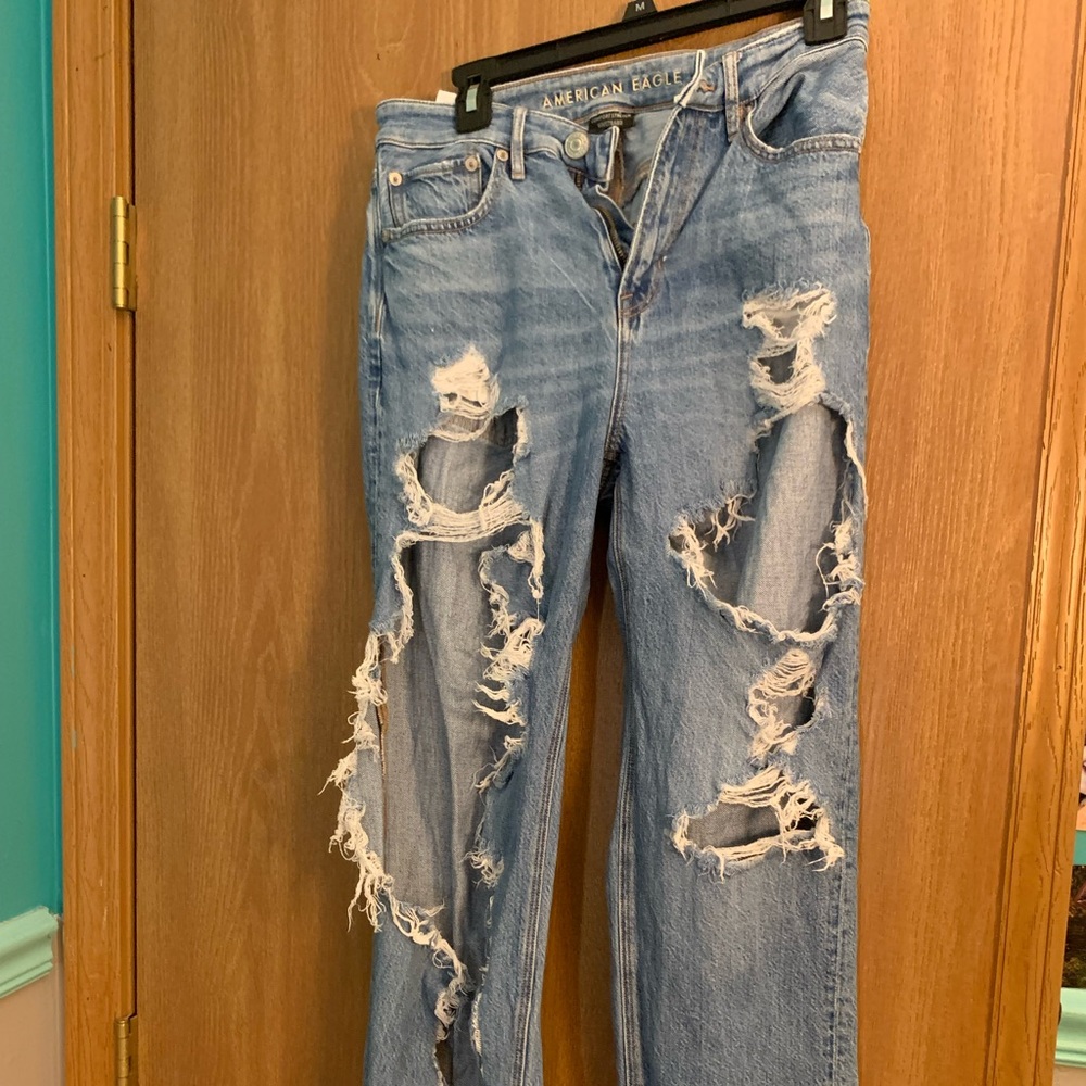 american eagle very distressed blue jeans